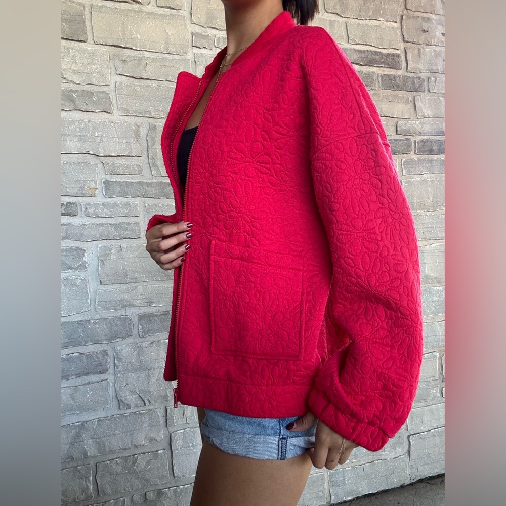 Red quilted bomber jacket with
